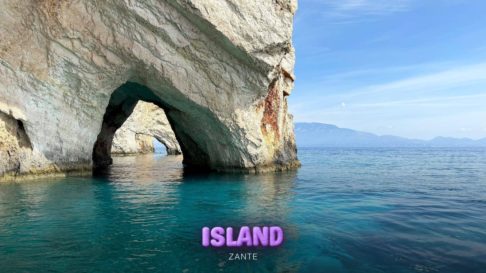 White rock arch of the Blue Caves on the north coast of Zante over turquoise water