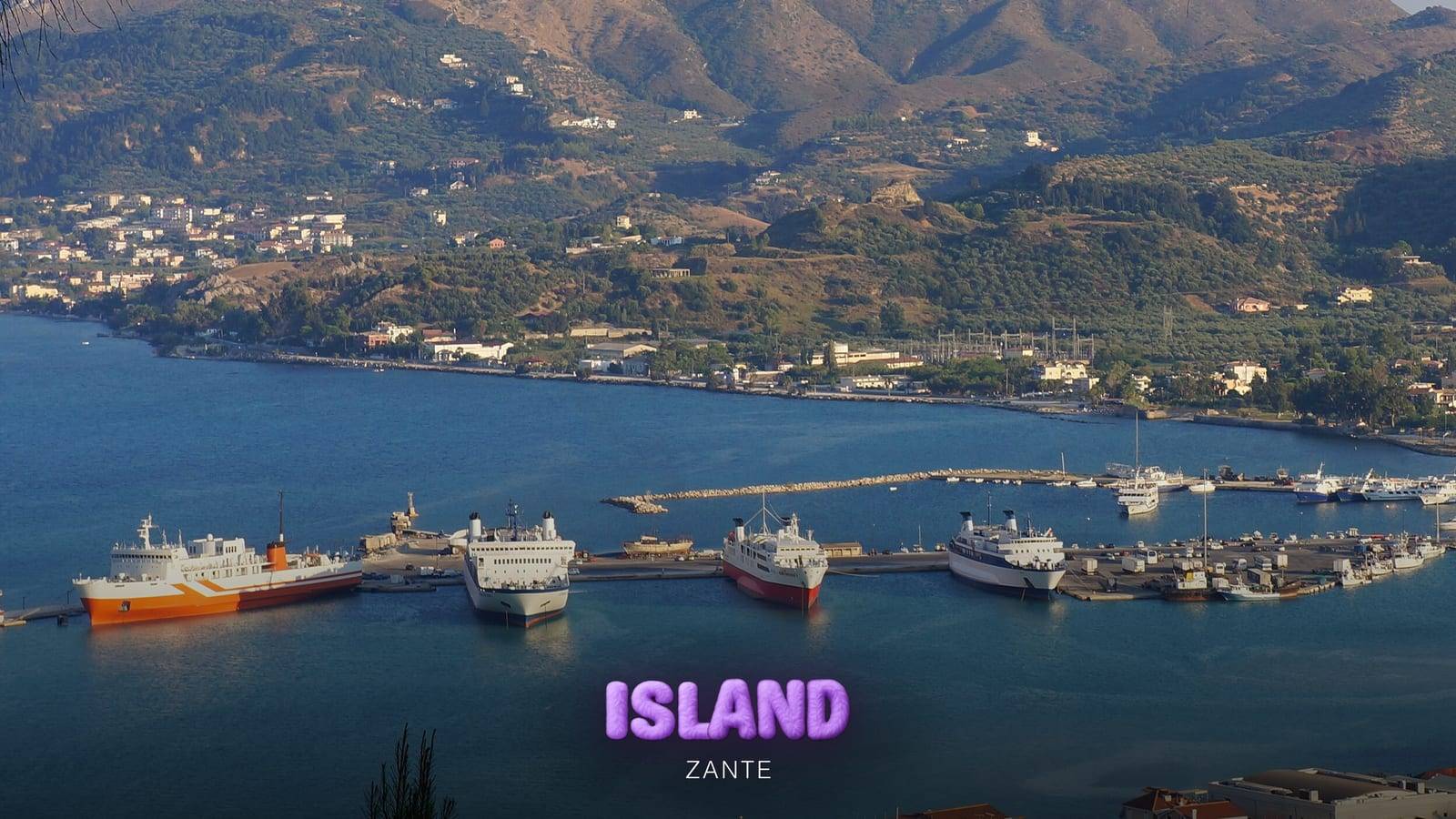 Ferries moored in the harbour of Zante Town, with the mountains behind