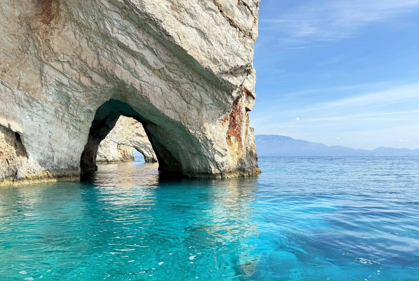 White rock arch of the Blue Caves, Zante, over turquoise water